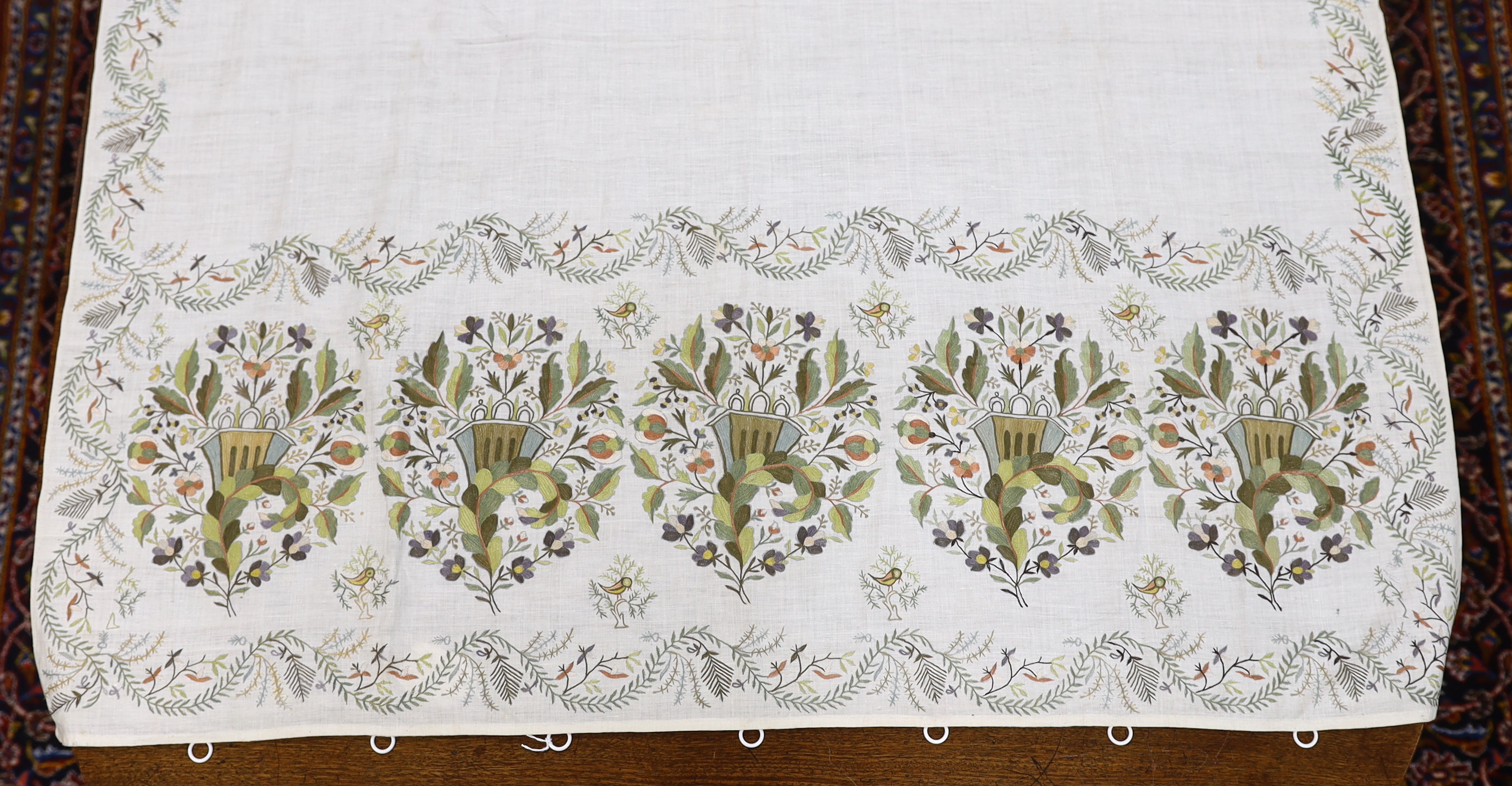 A late 18th-19th century fine linen chain stitched floral embroidered panel, possibly Kashmiri, using traditional design elements and embroidery similar from earlier embroideries of this kind worked on narrower looms, 22